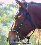 Sliding chin riding halter and reins set in black with "Prairie Dusk" padding/inset/reins and turks head cheek accents