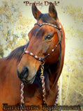 Sliding chin riding halter and reins set in black with "Prairie Dusk" padding/inset/reins and turks head cheek accents